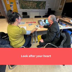 a wman getting a blood pressure check, text reads "Look after your heart"