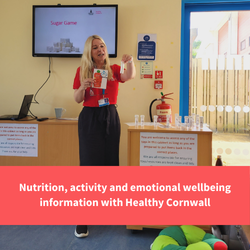 healthy cornwall staff member stands at the front of a group holding sugar