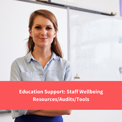 teacher smiling at camera, text reads "education support, staff wellbeing resources"